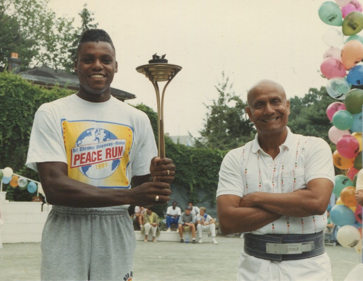 Carl Lewis gives Autographed World Record Shoes to Sri Chinmoy